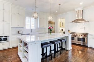 White kitchen with spherical light fixtures