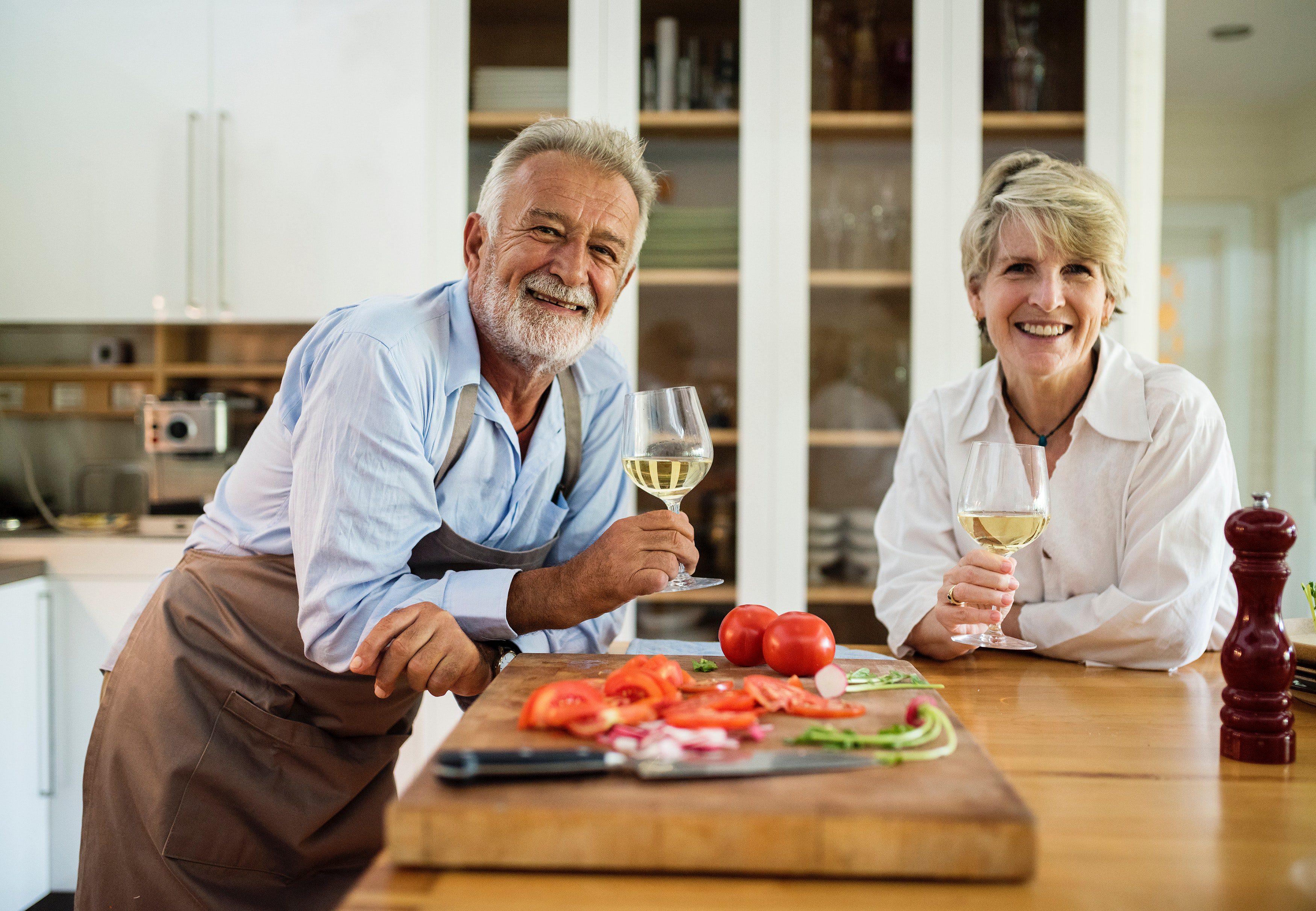 Elderly Couple Standing at a Kitchen Island
