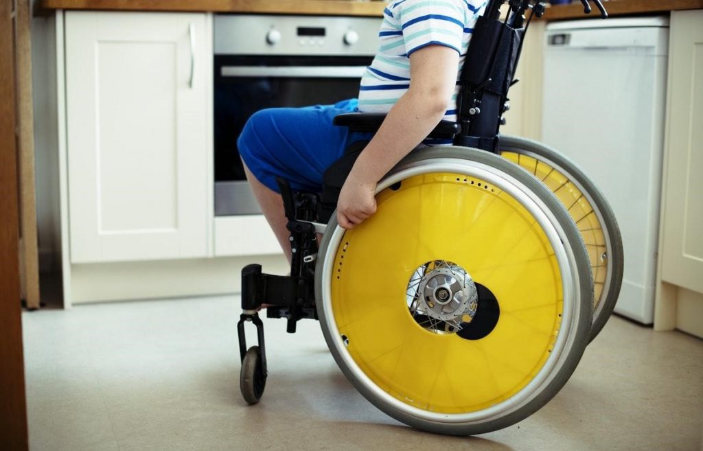 Disabled boy in wheelchair