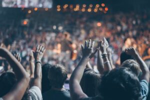 hands waving at a concert